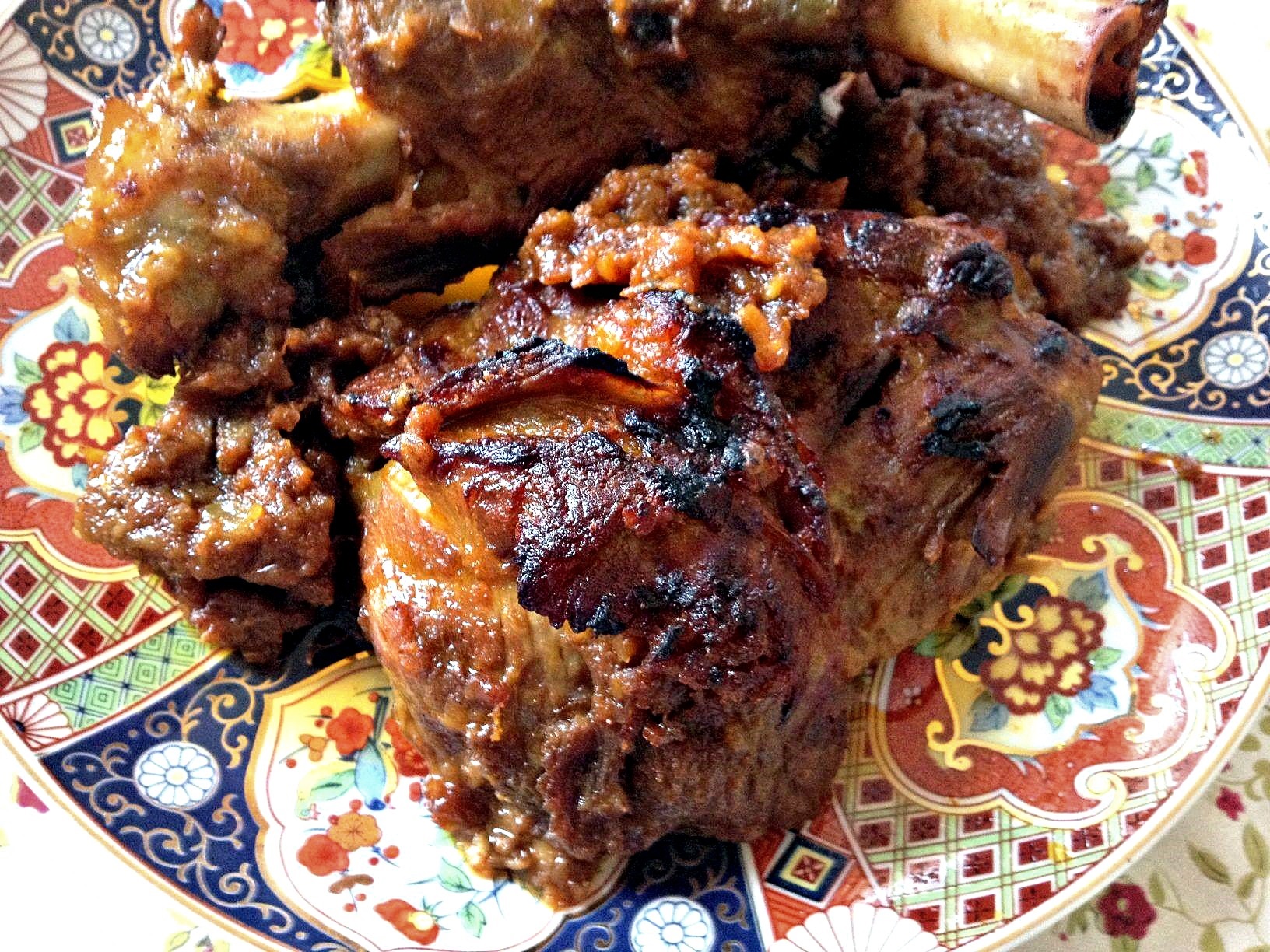 braised and roasted Moroccan lamb with onion confit on a platter
