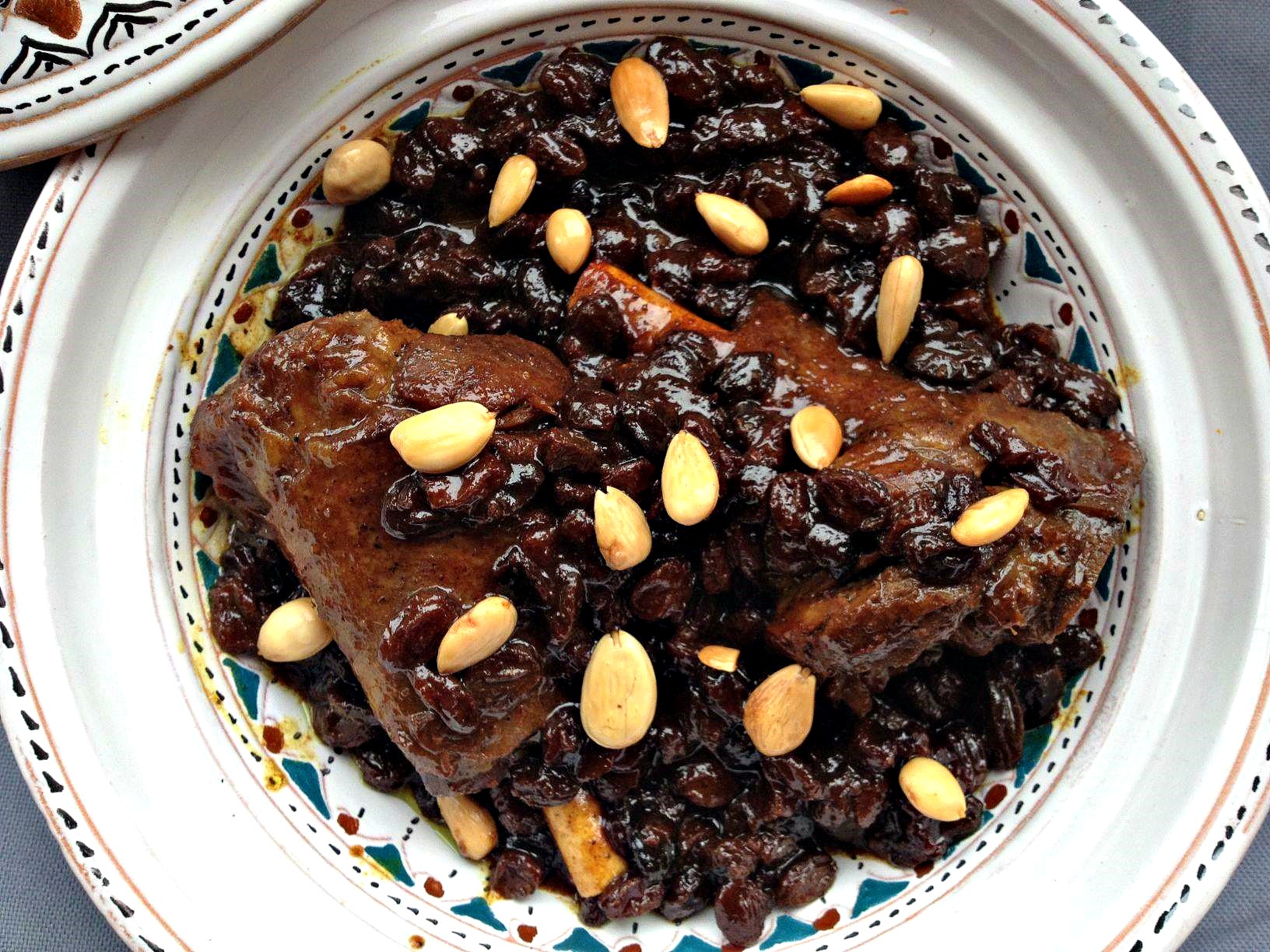 overhead photo of mrouzia, a Moroccan lamb confit with raisins, almonds and honey