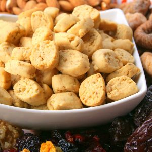 A bowl of Krichlate surrounded by dried fruits for Achoura.