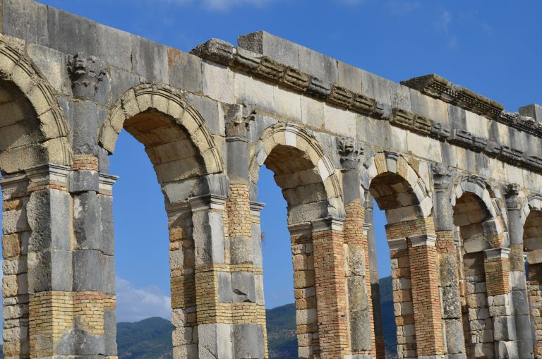 Massive stone arches from the Roman ruins of Volubilis in Morocco.