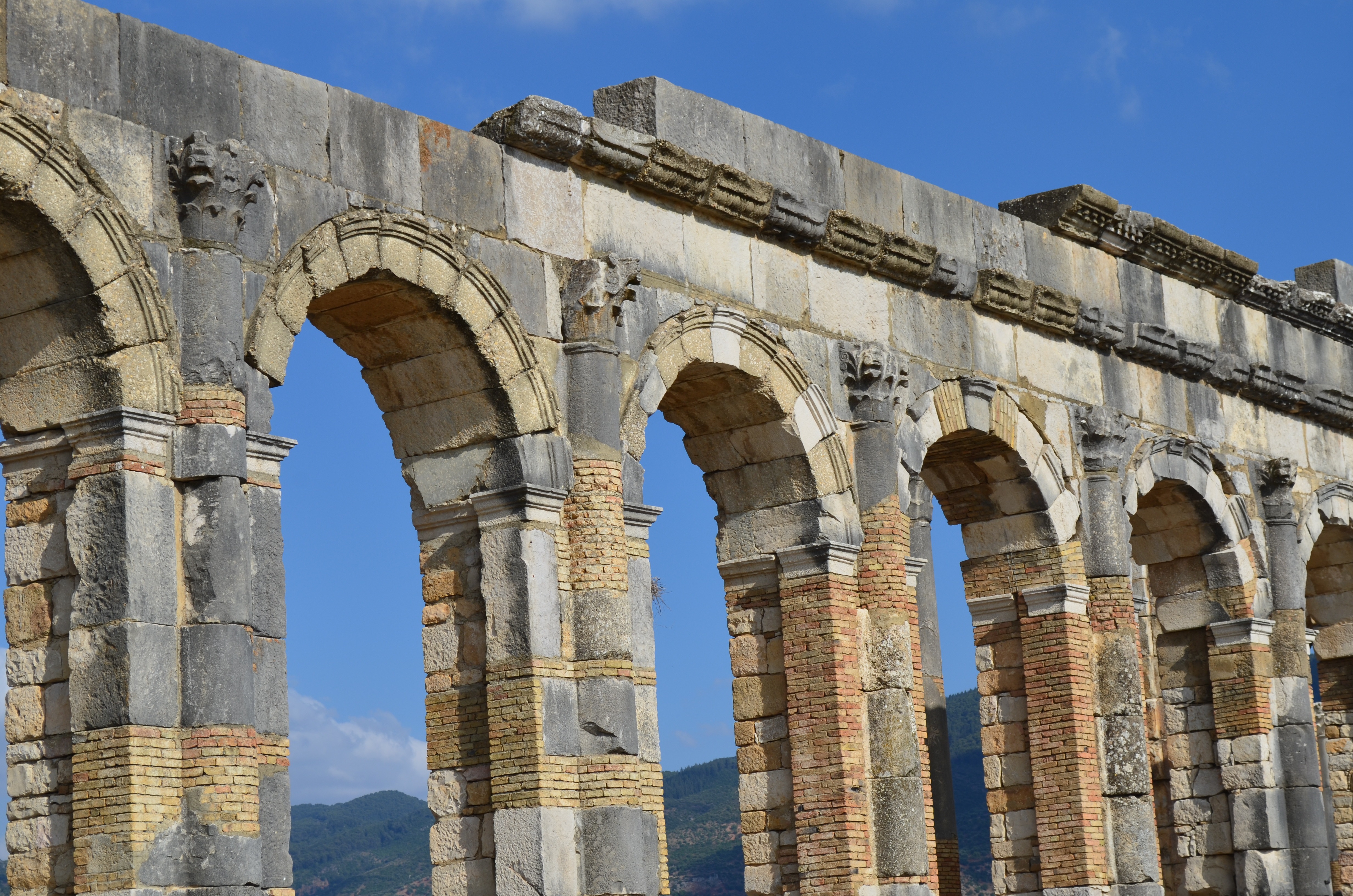 Massive stone arches from the Roman ruins of Volubilis in Morocco.