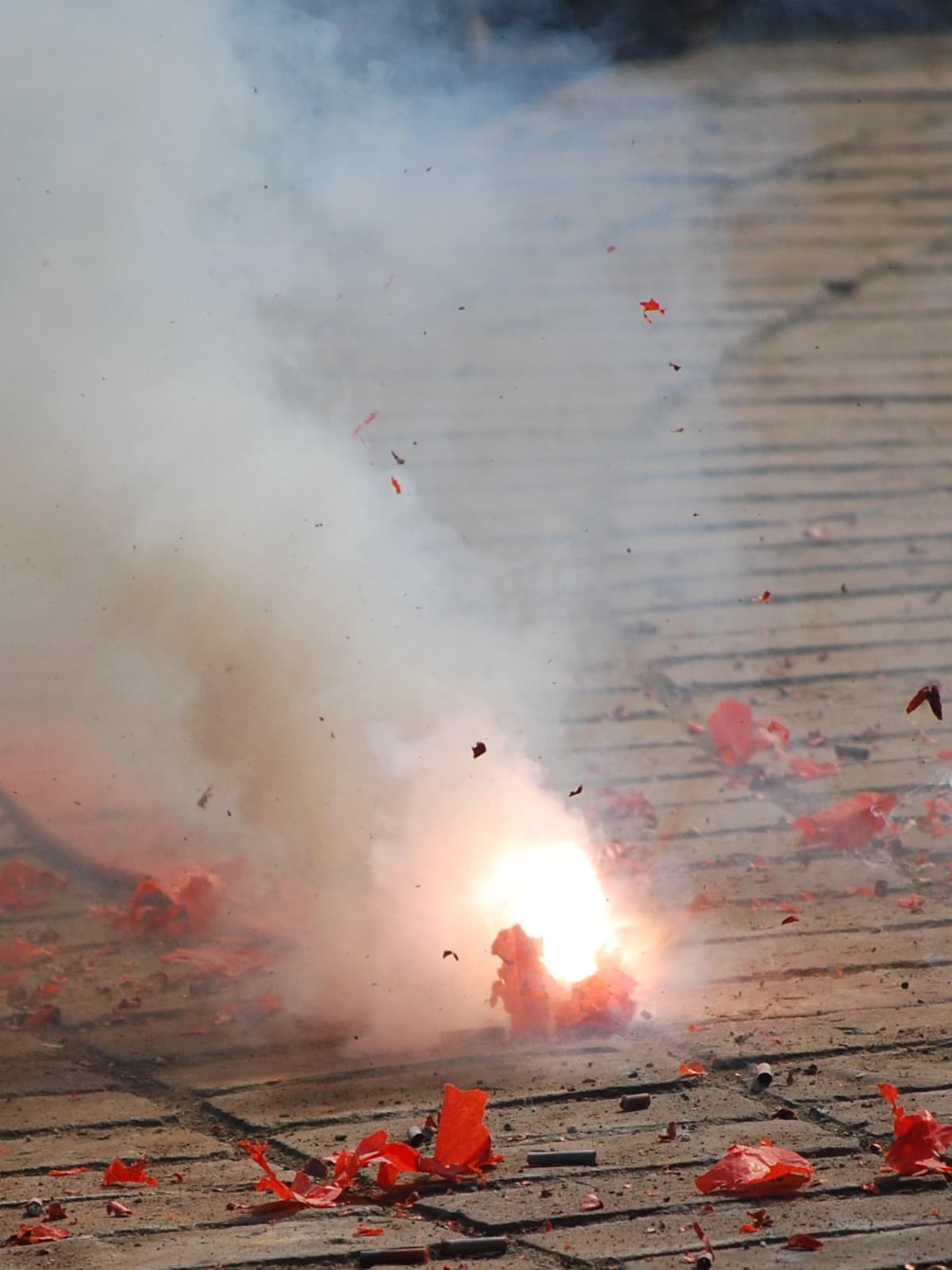 Smoking firecracker on the ground.