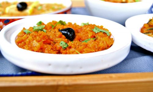 A small bowl of mashed carrots seasoned with a Moroccan herb and spice marinade called chermoula.