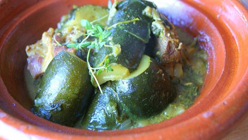 tagine M'qualli of meat and courgette/zucchini decorated with fresh thyme