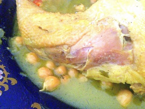 Chicken and chickpeas cooked qadra style with a light marqa.