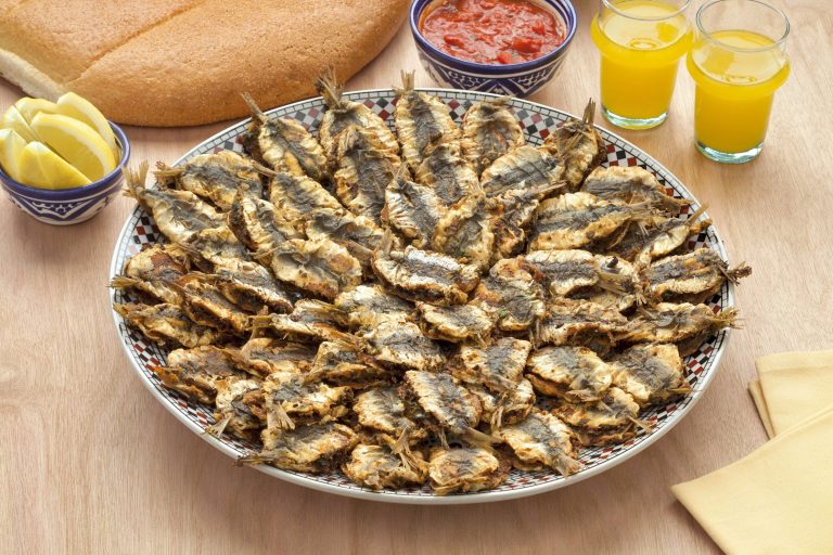 A large plate of fried sardines
