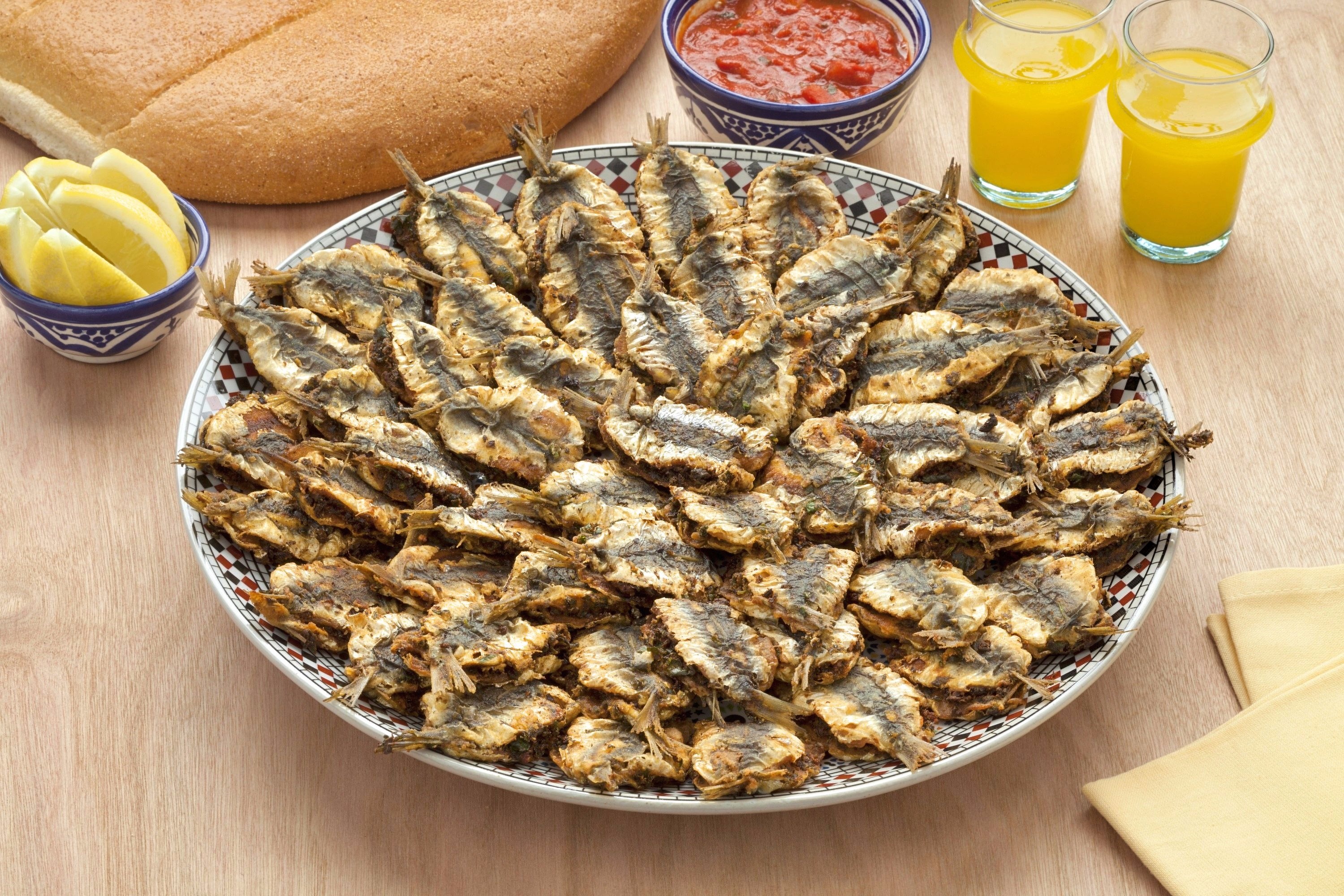A large plate of fried sardines