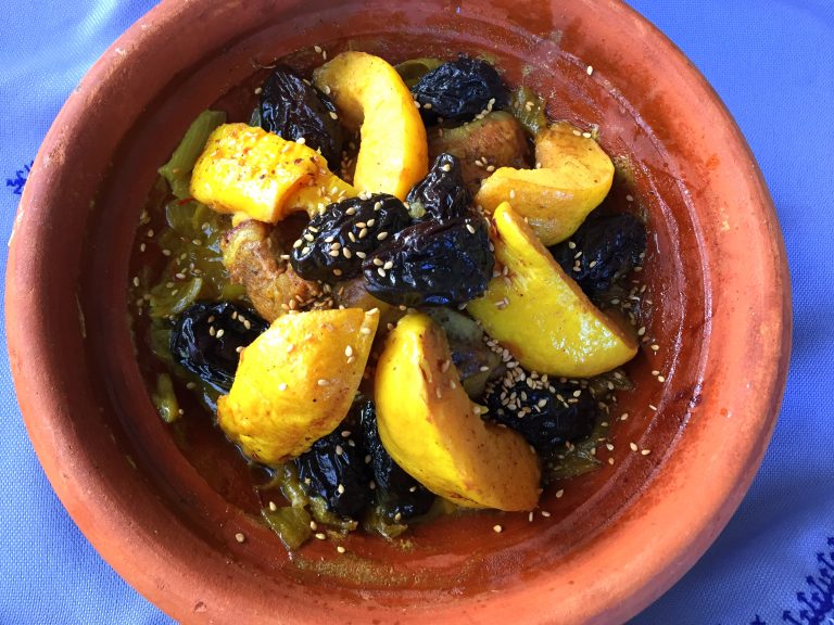 Moroccan tagine with lamb, quinces and prunes, cooked m'qualli-style and sprinkled with sesame seeds