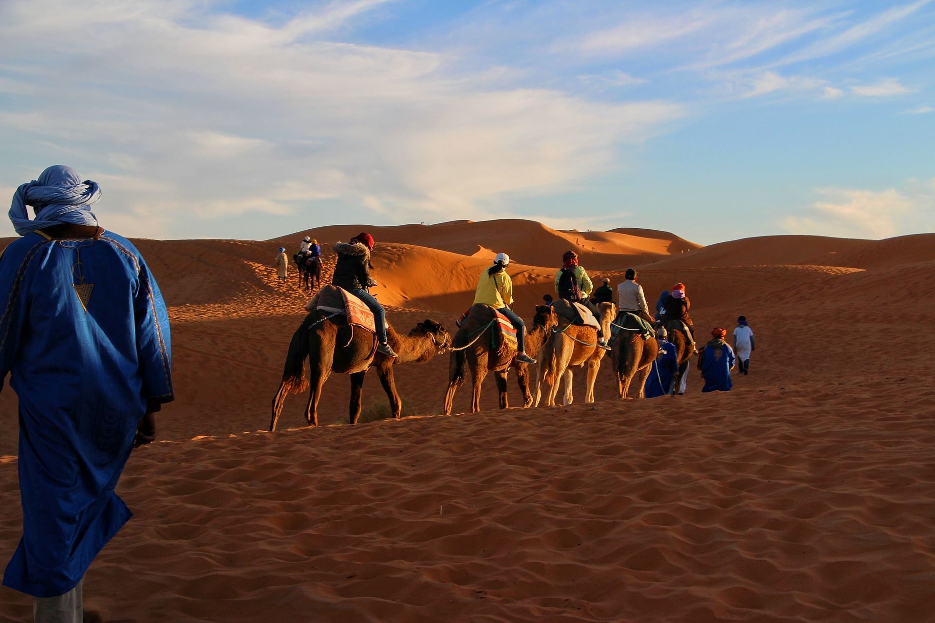 Tourists riding camels in Morocco.