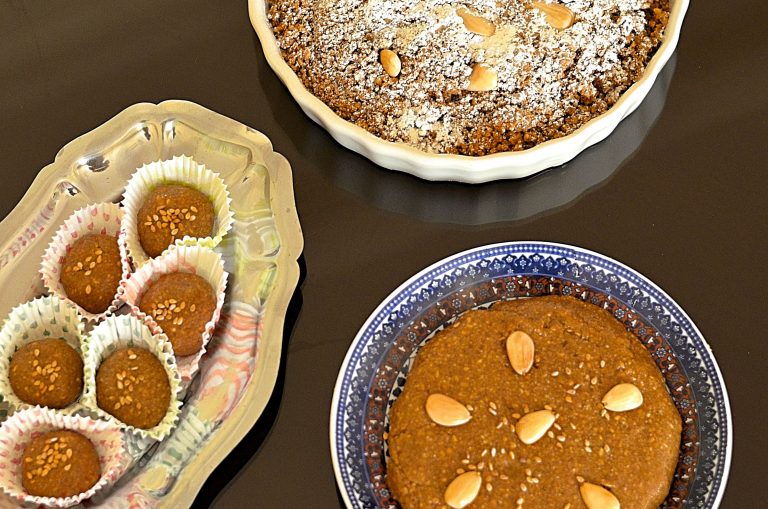 Overhead photo of three different presentations of sellou, a Moroccan paste-like sweet made from ground almonds, ground sesame and flour.