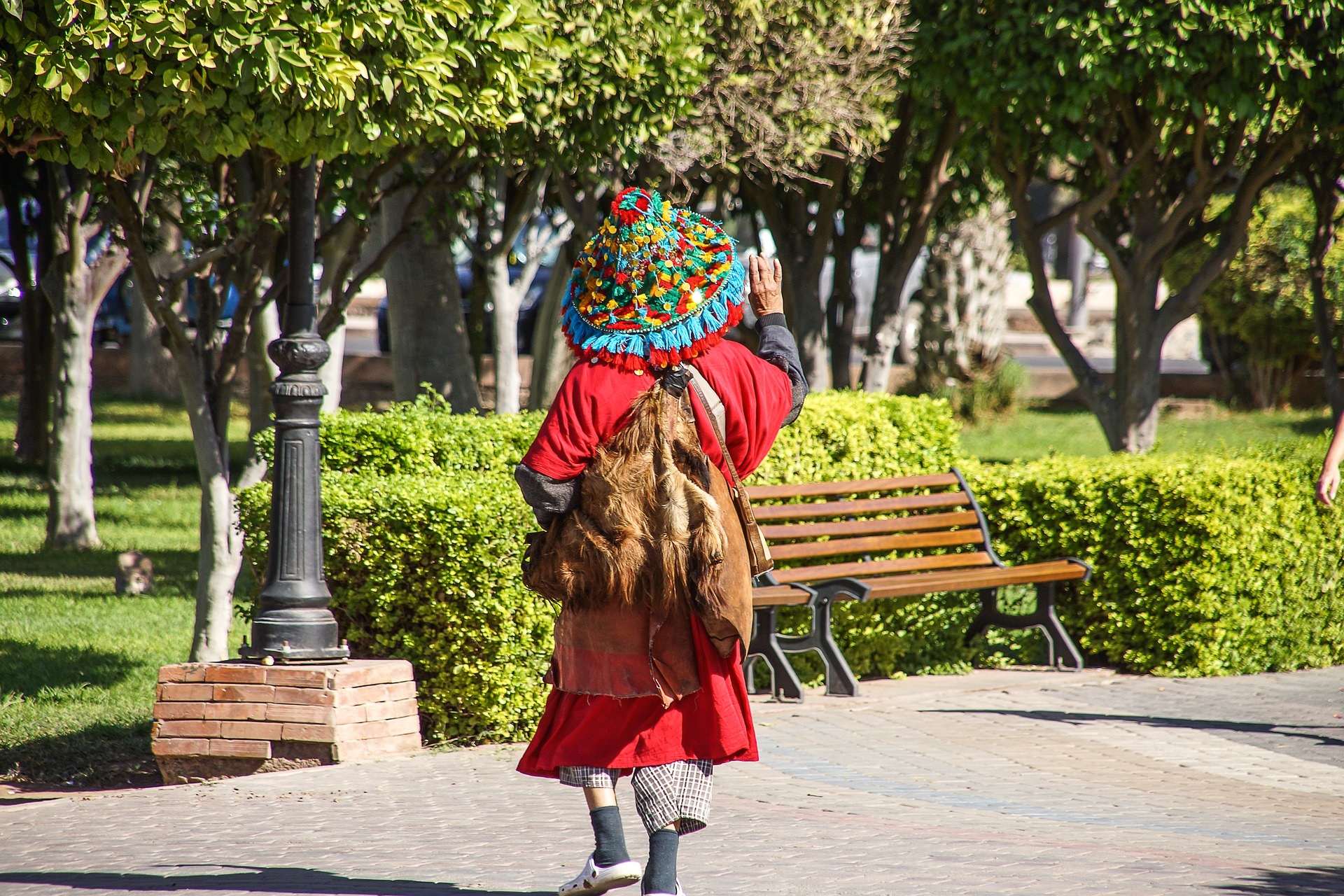 Rear view of a Moroccan water seller.